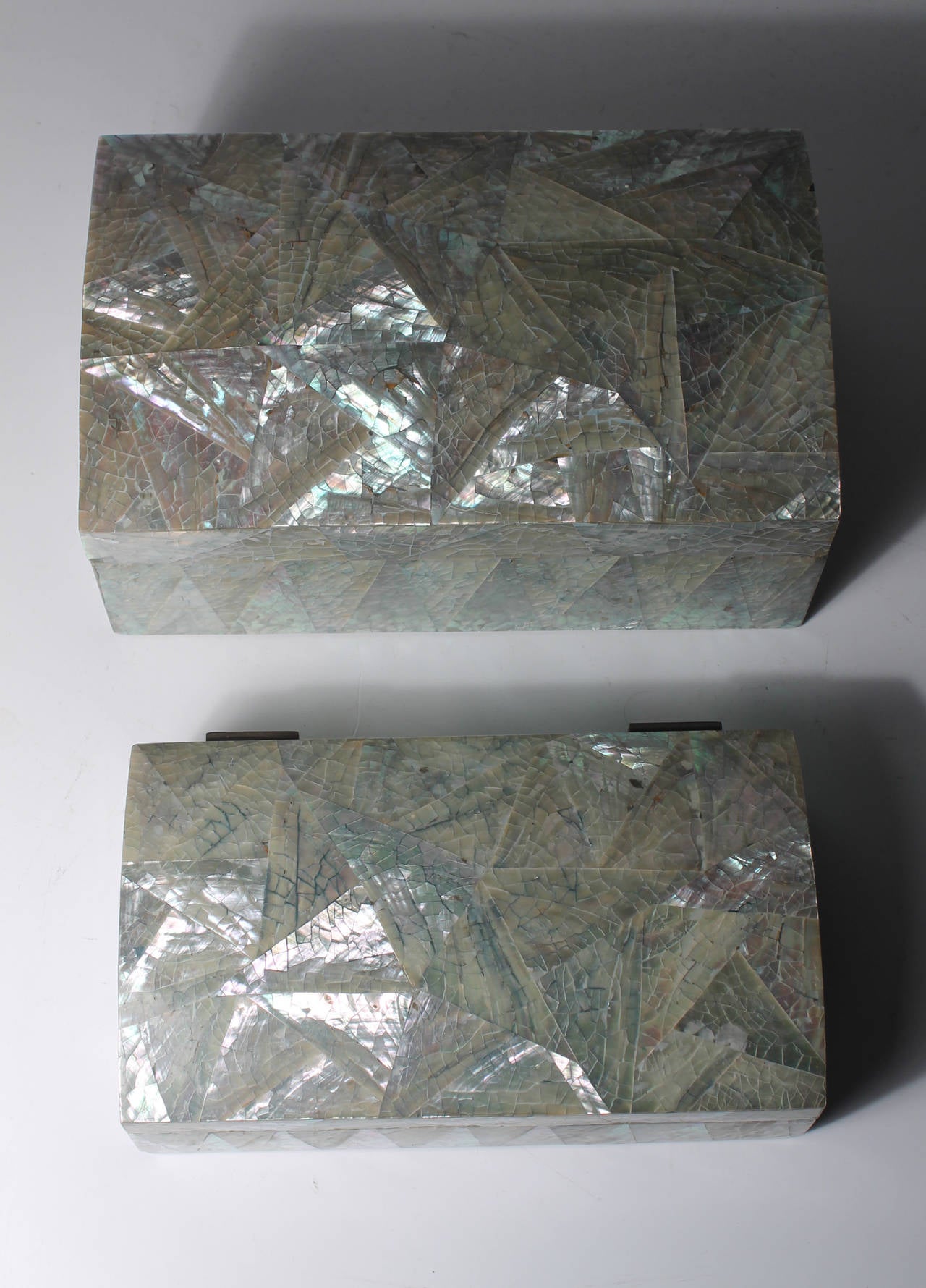 Pair of vintage crackled abalone jewelry boxes. Unmarked. Attributed to Maitland Smith.
Measures:
Larger box dimension:
7 7/8