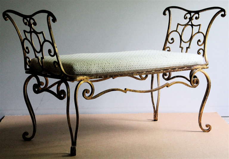 Gold leafed wrought iron Settee with pillow.