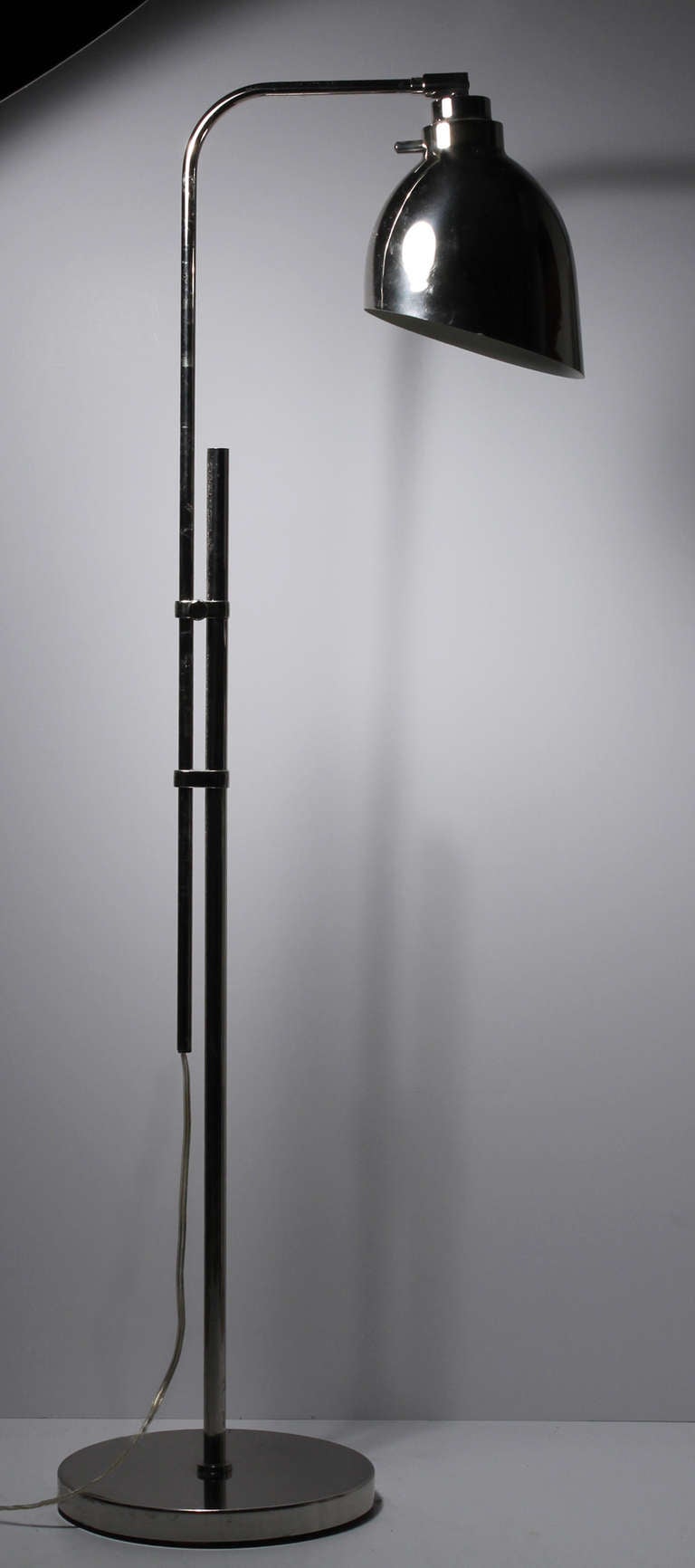 Architectural Kovacs chrome floor lamp.

Measures: Base is 10" diameter.
Height is adjustable.