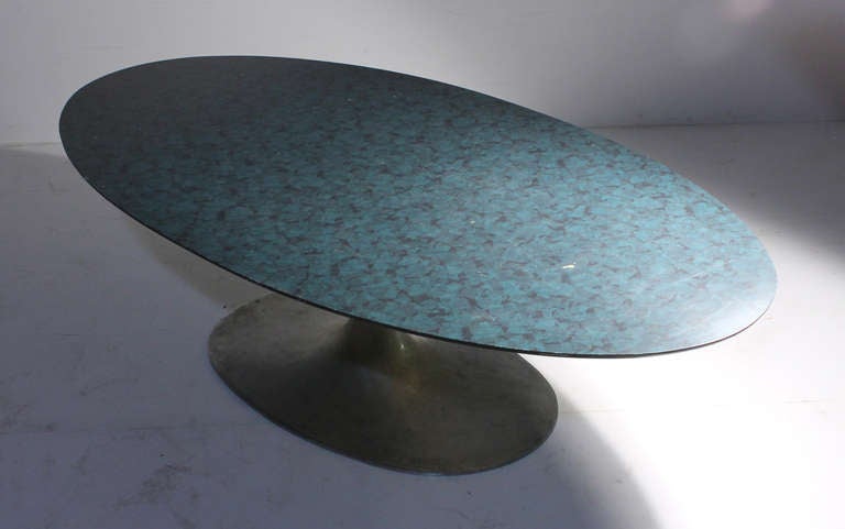 Scarce Maurice Burke for Arkana, England surfboard coffee table. Possibly a custom formica top with a blue and black abstract transparency pattern.

Need to confirm dimensions.

Style of Eero Saarinen for Knoll.