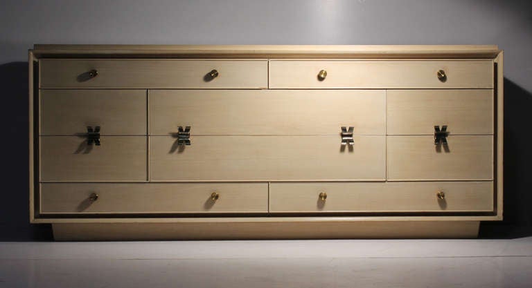 A rare Paul Frankl designed sideboard, buffet, or dresser for Johnson.

A rare variation of the x-handled design he did for Johnson furniture company. These x handles have a beautiful curvacious form and are split in the centre functioning as two