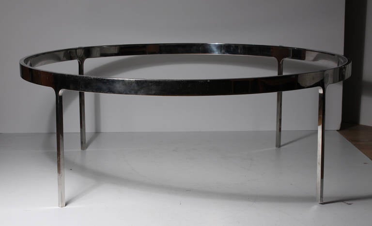 Circular chrome finish coffee table attributed to Nicos Zographos. Unsigned.
Beautiful base ready for circular glass or marble to be cut to specs.

Chrome finish to top edge shows wear (light scratches). Please contact to review photos in