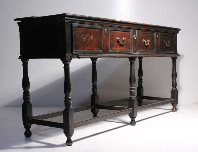 A 19th century English or Welsh Rustic Console Table. In all likelihood this piece had a super structure or open shelf that rested on the top. A beautiful piece with lots of age/patina and character.

This is an older piece with some damage and