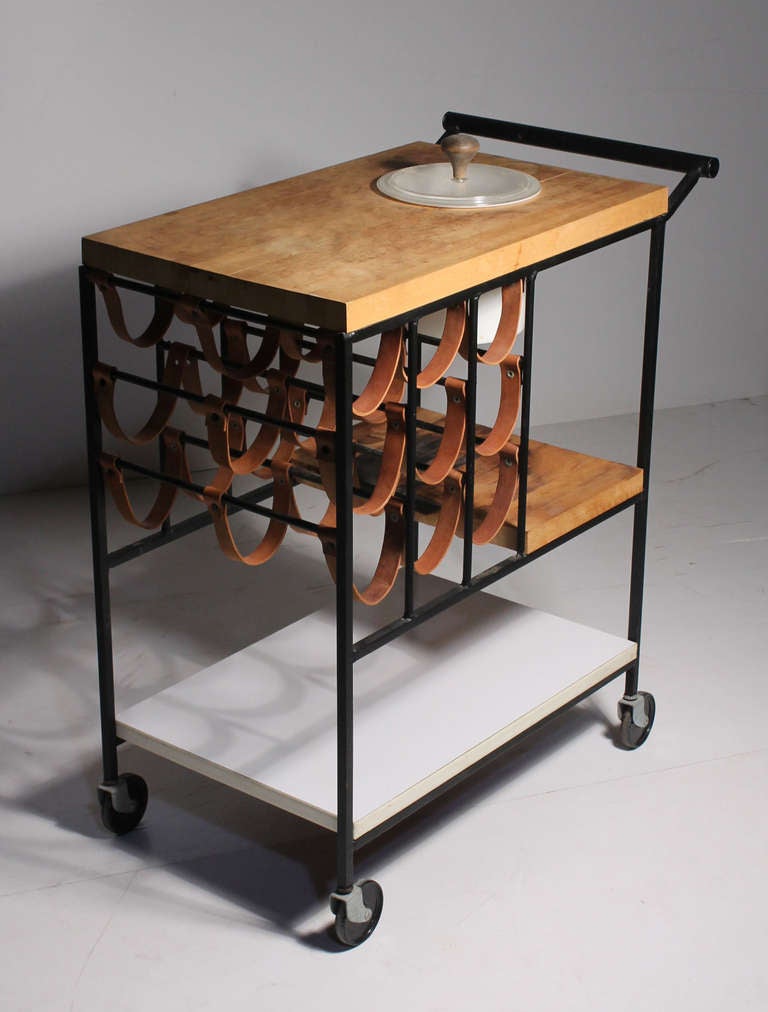 Vintage serving cart for Raymor. I see this cart design attributed to Arthur Umanoff. This one has the rare ice-bucket with a beautiful handled lid. All original.

Measures: 14.75