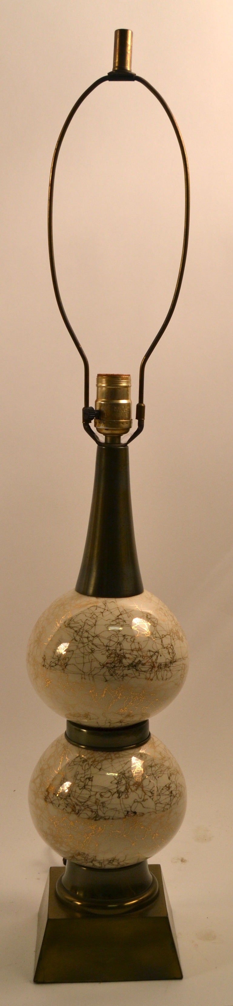 Brass base, supports stacked white ceramic balls, with gold 