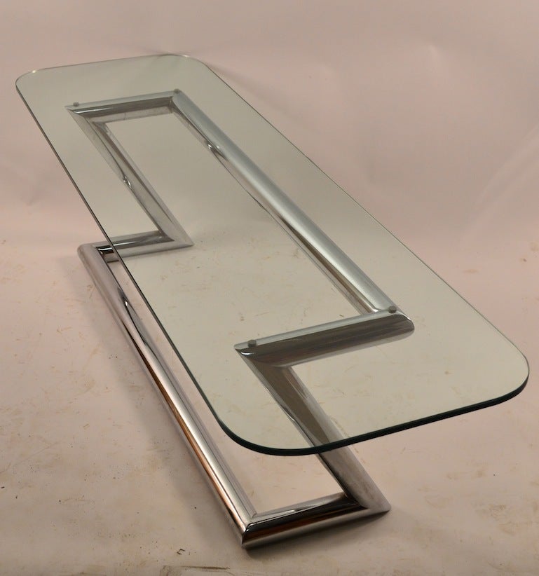 Plate glass top, tubular bright chrome base. Ca 1960/ 1970's attributed to John Mascheroni, 