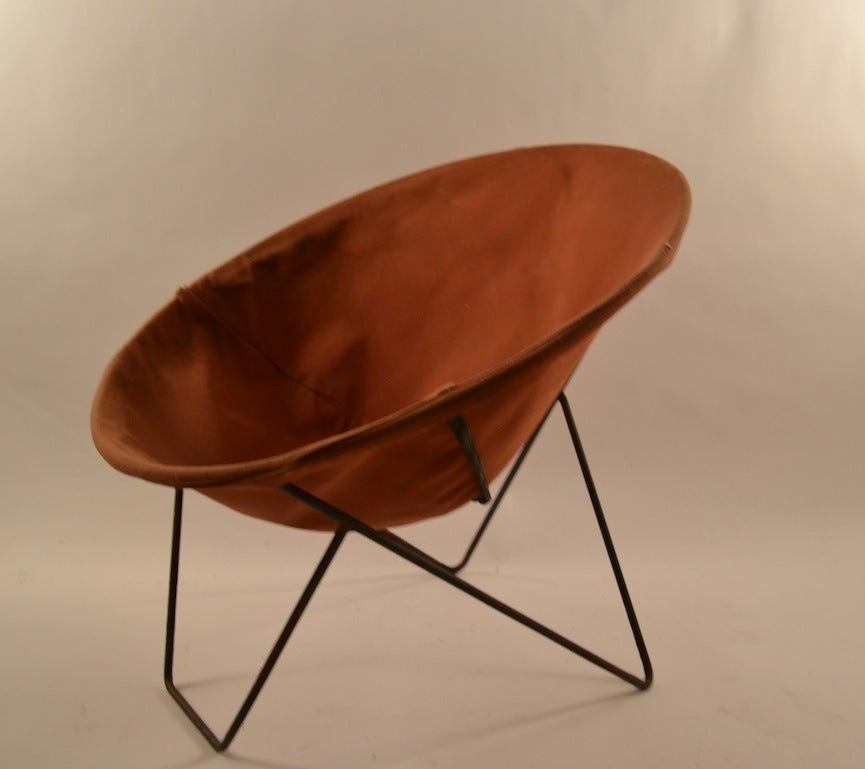 Round scoop design, solid iron rod frame, original canvas sling seat (shows some wear) Frame shows some surface rust, normal and consistent with age. Suitable for indoor or outdoor use.