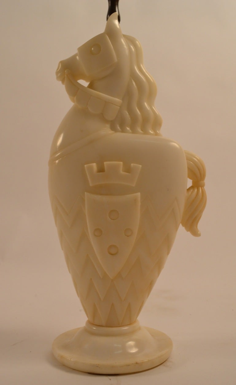 Interesting Art Deco period alabaster lamp in the form of a Knights horse, complete with armorial crest decorated garb. Height to top of socket 17.75