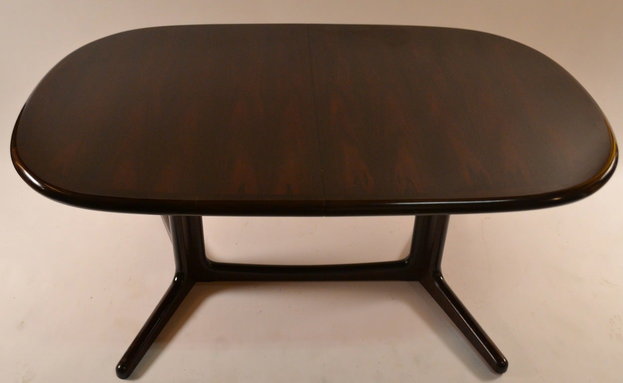 Danish Modern dining table with two original leaves. Minor wear to finish, ready to use original condition. 64