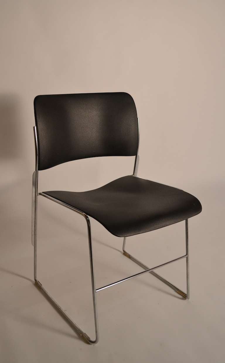 Black enameled seats, chrome legs, original plastic glides intact. Great clean set of David Rowland chairs.