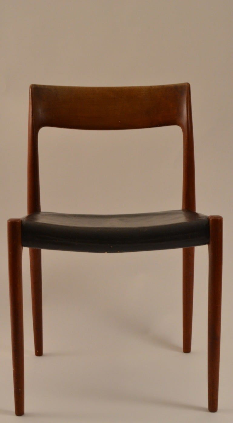 Hard to find sets of eight matching dining chairs. J.L. Moller Danish Modern teak and leather chairs. These chairs show some  cosmetic wear, normal and consistent with age but are sturdy, and ready to use.