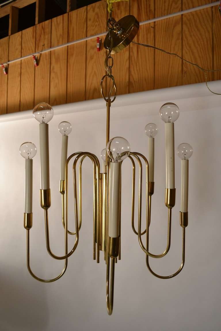Stunning eight arm uplight hanging chandelier.Complete with original canopy, and chain Designed by  Gaetano Sciolari for Lightolier.
Height in listing includes chain, height without chain 25