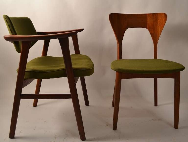 Neils Koefoed for Koefods Hornslet Danish Modern teak dining chairs. This set includes two of the hard to find arm, or 