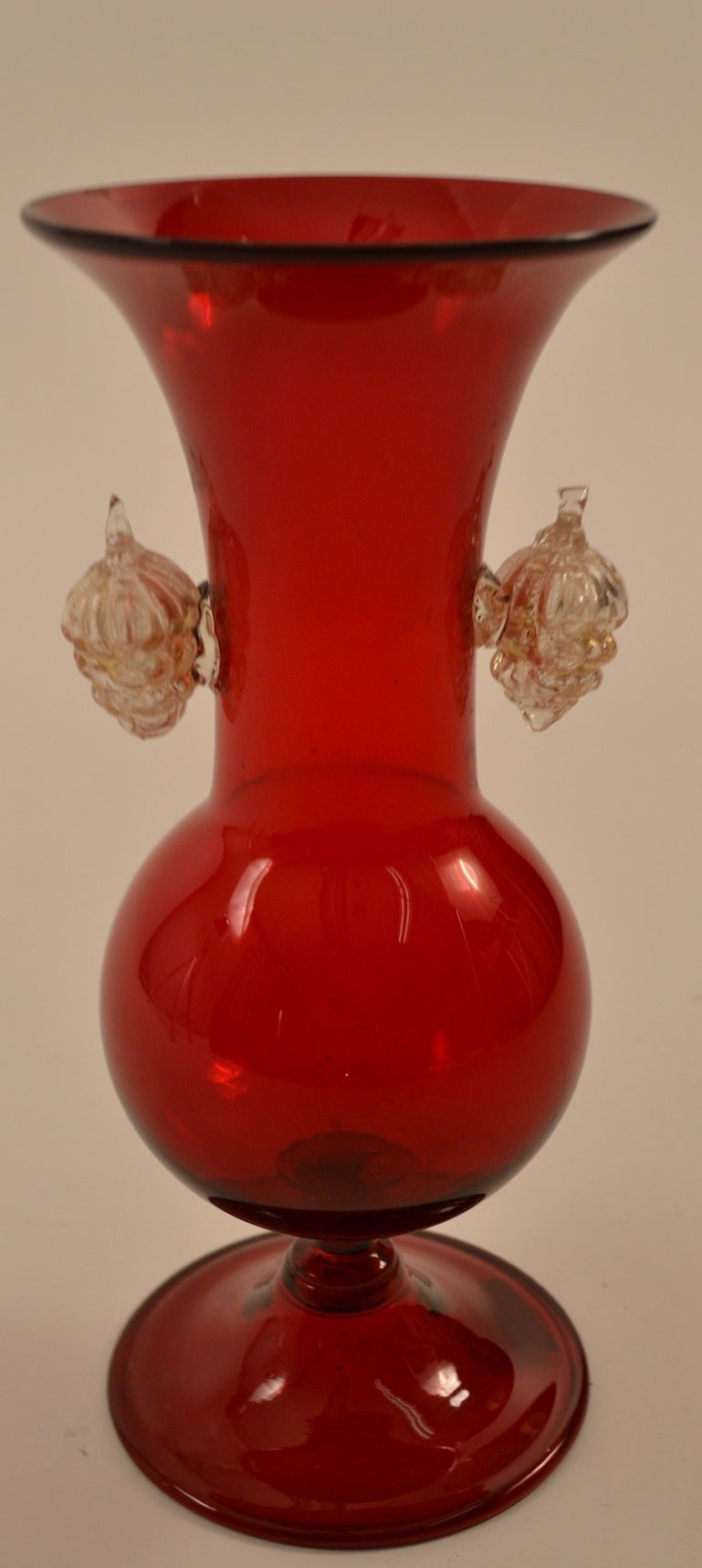 Early Barovier vase in red glass, with gold fleck inclusion grape clusters decorations  applied.  This interesting classic Murano vase still retains the original paper label, as shown.