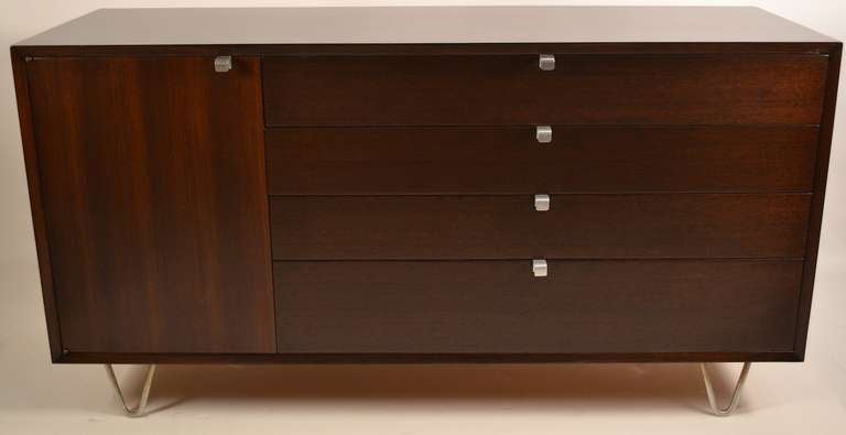 Nice George Nelson for Herman Miller dresser. Recently professionally restored to rich dark finish. One side has a cabinet door, flanked on the other side by four drawers.