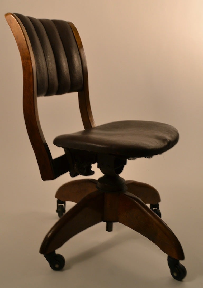 Early Industrial work, task, desk chair. This version swivels  ( complete 360 ) and the back support tilts. The tension for the back rest is adjustable to suit your taste.
