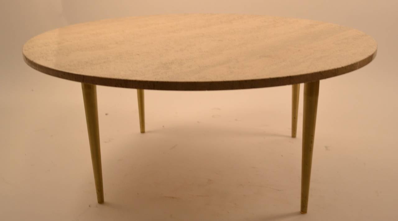 Travertine top Italian Coffee, Cocktail Table. Round top, with tapered pole brass legs.