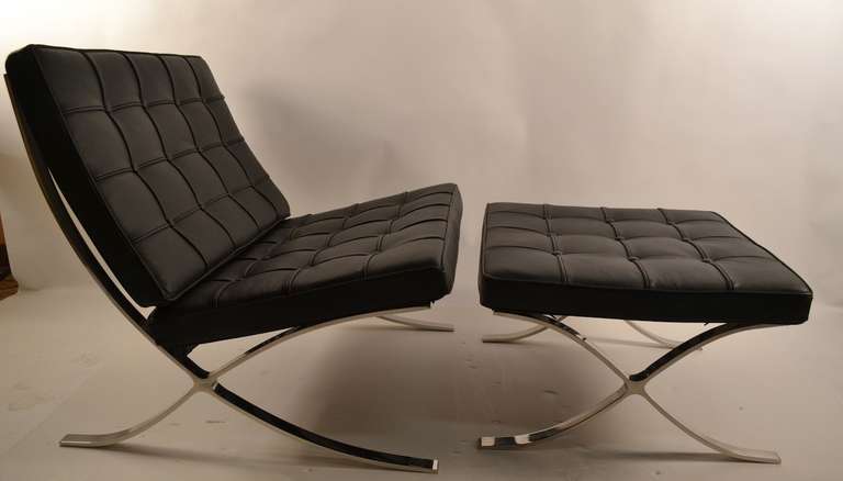 After the classic Knoll version, clean and high quality. Barcelona chair and ottoman. Black leather with bright chrome frame.