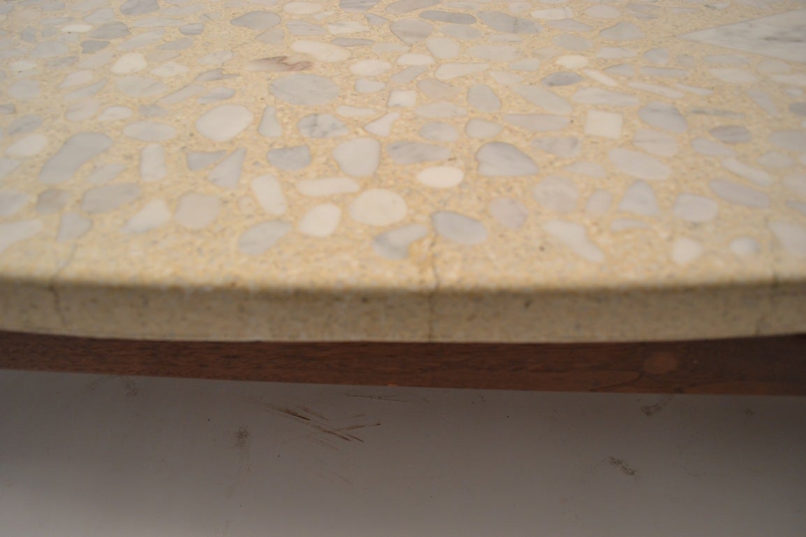 Classic Probber terrazzo top, sculptural walnut base surfboard coffee table. As is usually seen in this model, the top has cosmetic cracks in the top ( it is a 