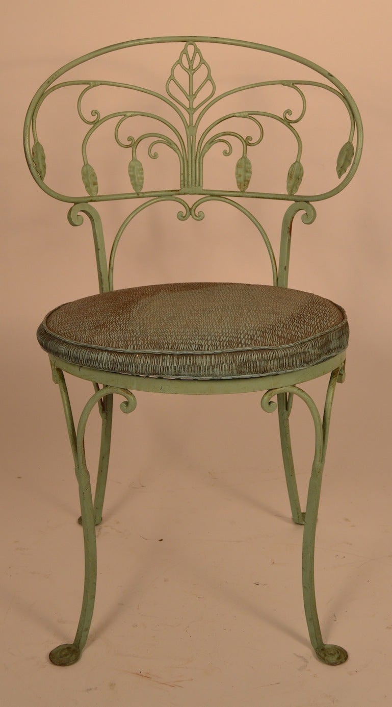 Set of Salterini dining chairs, four side, and two arm chairs. All are in original green paint finish, wrought iron Art Deco style metal work. These chairs are in great condition structurally, the original seat  cushions are very worn, and you will