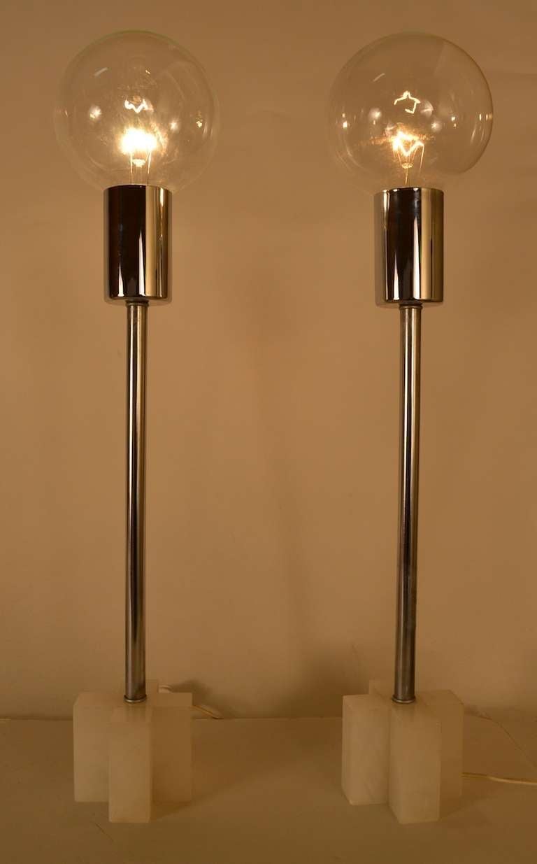 "X" , or cross bases, made of Italian marble, or possibly alabaster, bright chrome vertical standards, exposed ball bulb tops. If you prefer a shaded light, smaller bulbs, with clip on shades are an easy solution. Bases are marked