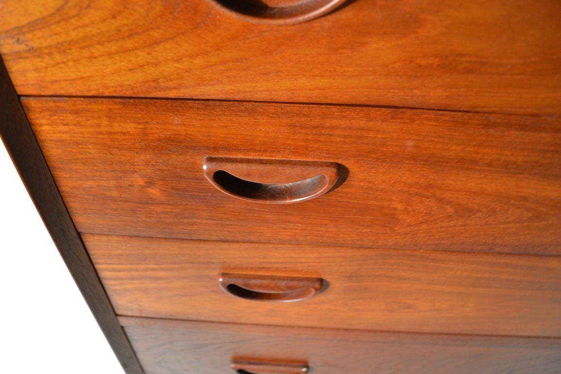 Teak five drawer dresser designed by Peter Hvidt / Molgaar Nielsen for Illums Bolighus. Classic case piece from the Danish Modern school. This example is in original estate condition, and shows minor wear, normal and consistent with age.