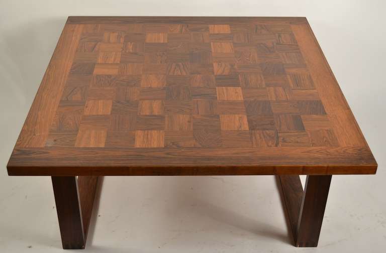 Parquetry checkerboard rosewood top, on box jointed legs.  Expected quality  of design and construction from the recognized master Arne Vodder. Classic Danish Modern table, fully and correctly marked. Some slight nicks and wear, but original