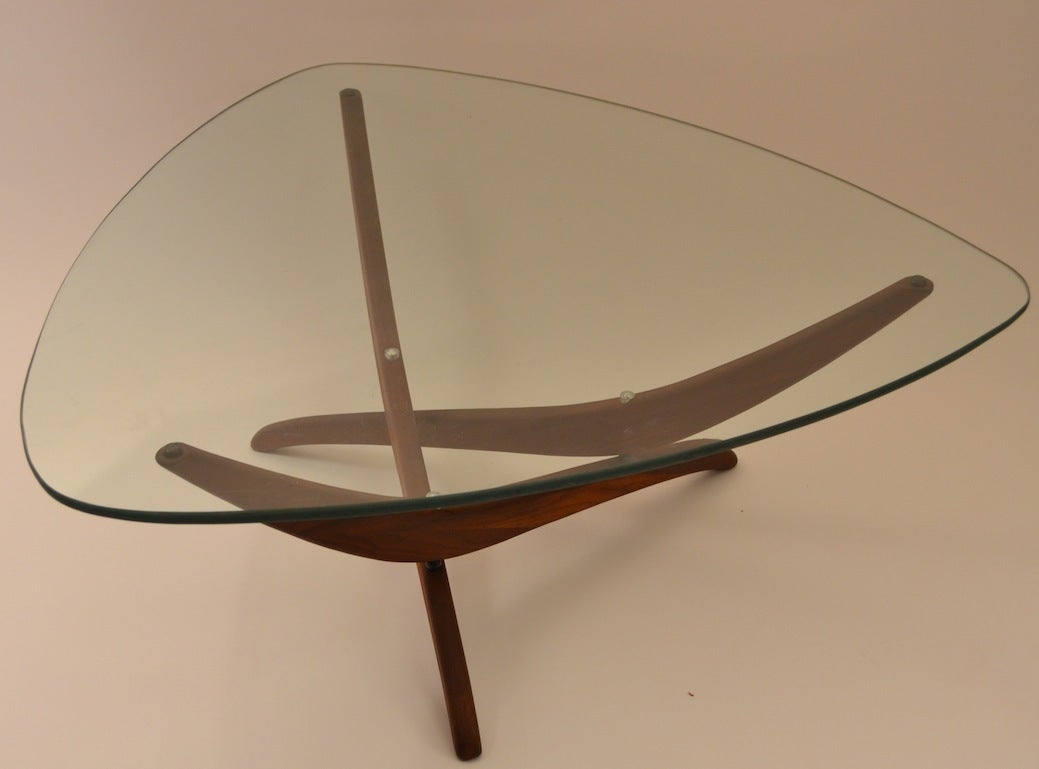 Very nice plate glass top with sculpted walnut base, with aluminum fitment details. Thick  ( 1/2