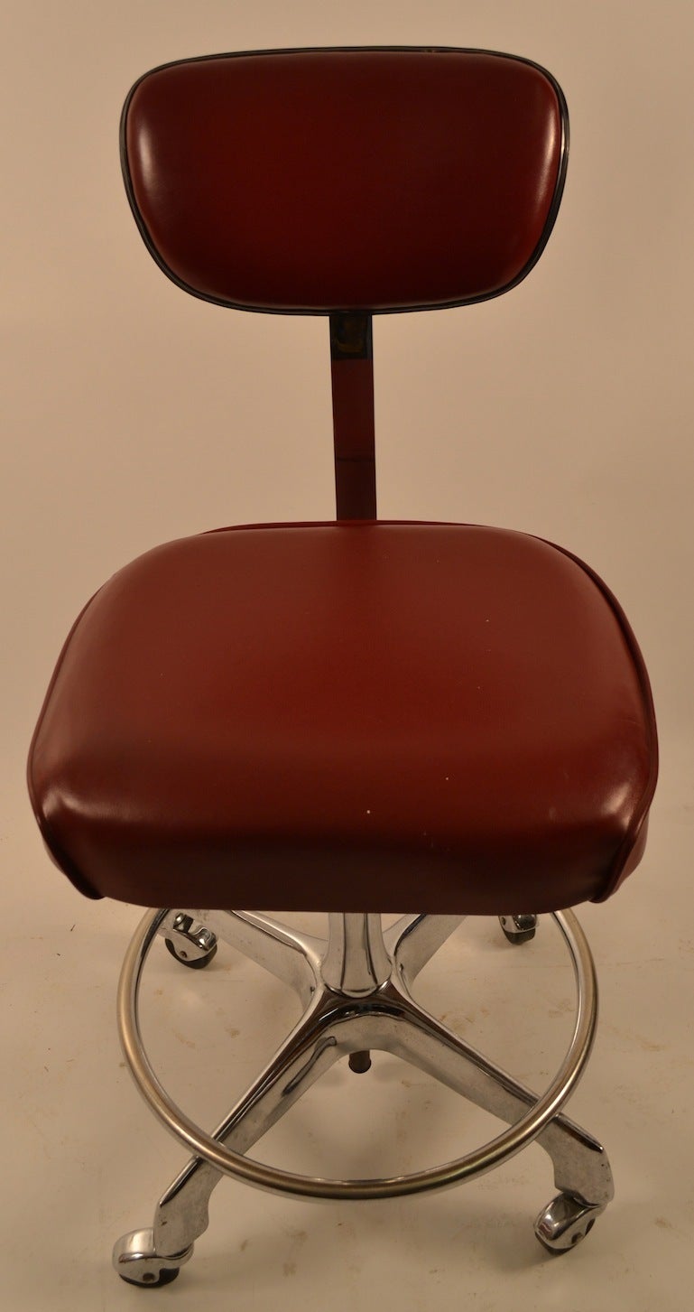This chair can be used either as a desk chair, or drafting stool as the seat height adjusts from low position ( 20