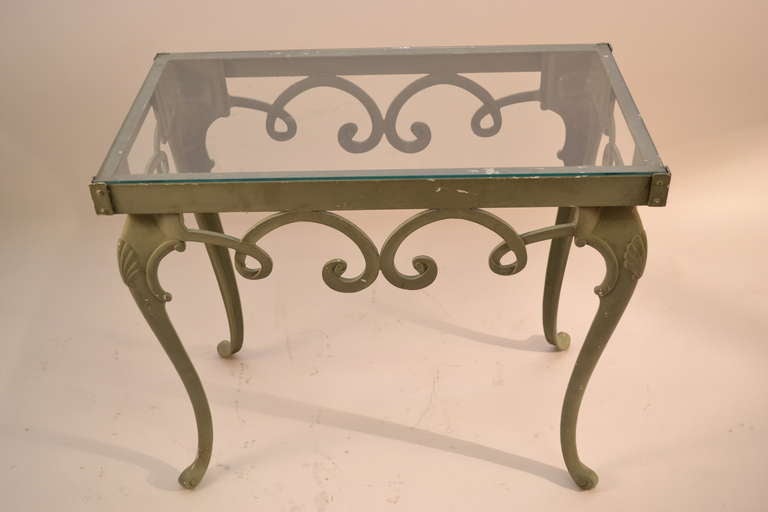 Classical style cast aluminium base with shell carved cabriole legs. Original glass top included but has a small chip, can be replaced if preferred by buyer. Later grey paint over original white paint surface. Suitable for indoor or outdoor use.