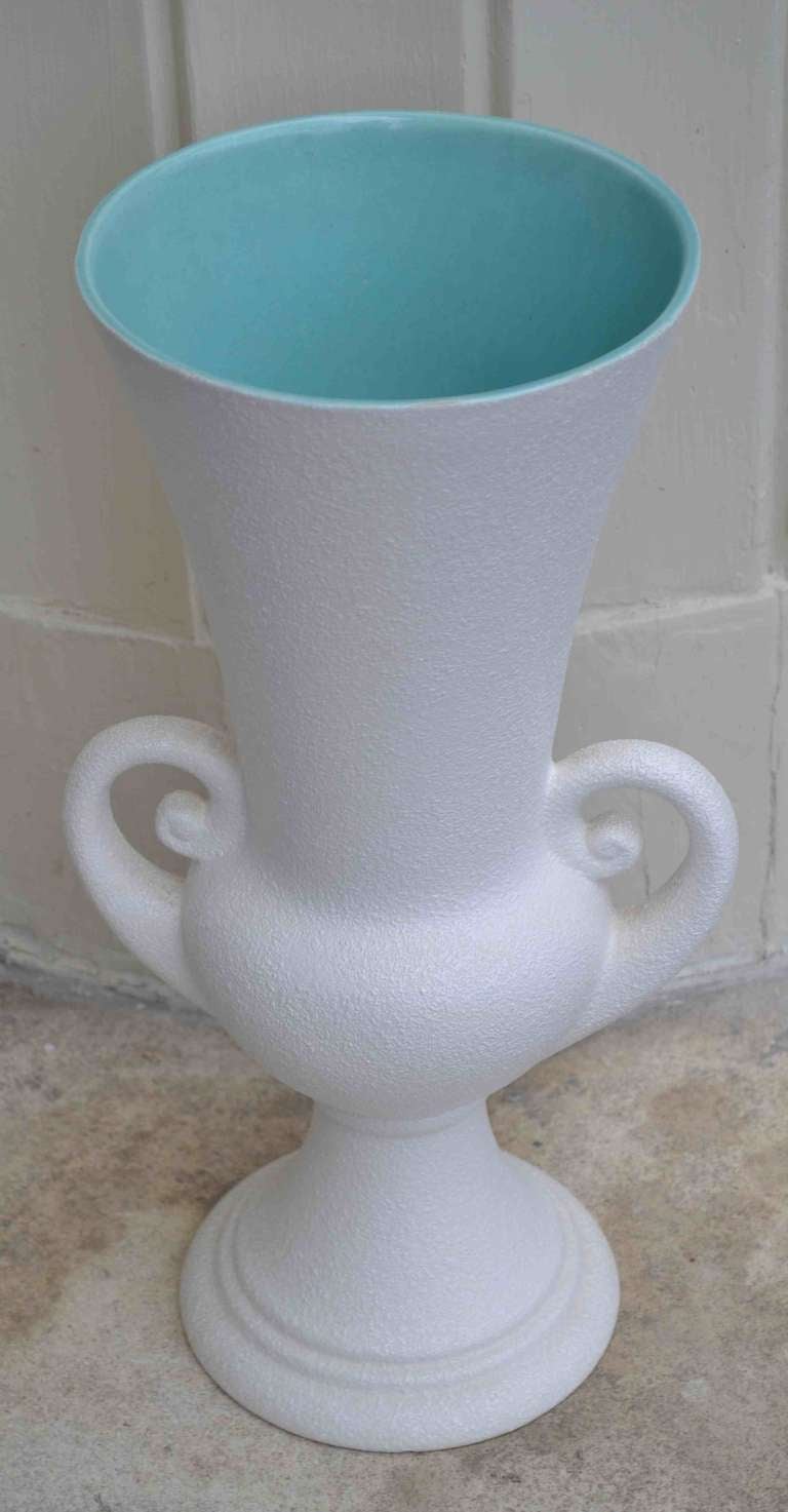 "Royal Haeger" urn form pottery vase. Classical form reinterpreted in the Mid-Century Modern idiom. Textured white exterior, Caribbean blue interior. Marked on base" Royal Haeger 436".