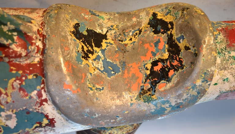 Painted "Spring Rocket" originally designed to be installed in a playground. The spring coil would have been set into a cement bed. Wonderful paint patina, slight crack in the aluminium body, not structural or major. Rocket marked