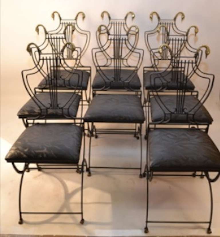 Collapsible steel frame chairs, with brass swan head 