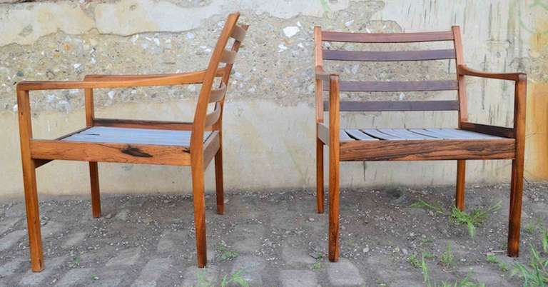 Fine pair of Ole Wanscher arm chairs, in original finish, with original cushions. Solid Rosewood construction.