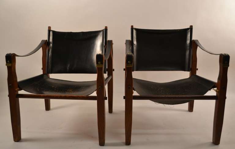 Pair of campaign chairs, both bearing 