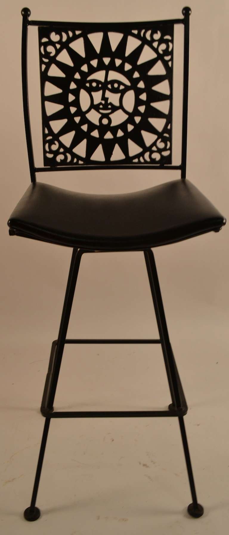 Five matching swivel counter, bar stools designed by Arthur Umanoff.