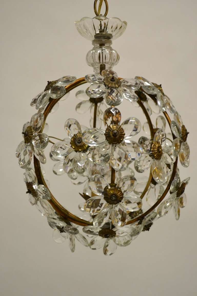 Sweet French ball from chandelier. Brass metal frame supports applied glass/ crystal pedaled flowers.  Illuminated by single candle bulb.Working, wired for US.