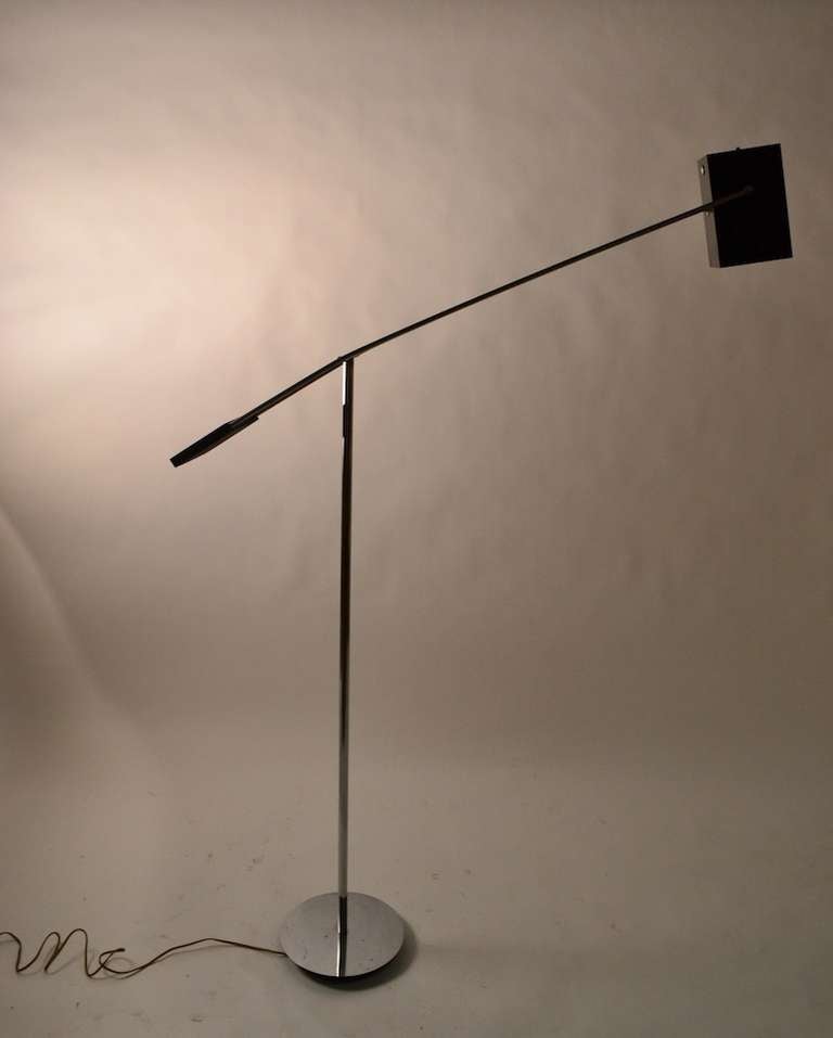 Nice adjustable counterweight floor lamp in black and chrome. Square hood shade will tilt, and the chrome balance arm will raise and lower, as well as swivel, to adjust light to desired position. Dimensions for height are for lamp in position shown.