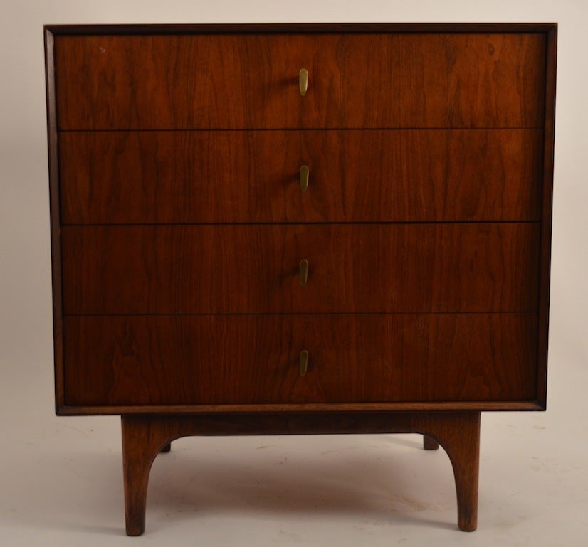 Four drawer cabinet can be used as a night table, or small chest of drawers. Figured veneer drawer fronts, brass pulls, on raised  sculpted legs. Please view the matching dressers we have listed from this same suite, if you need more pieces.