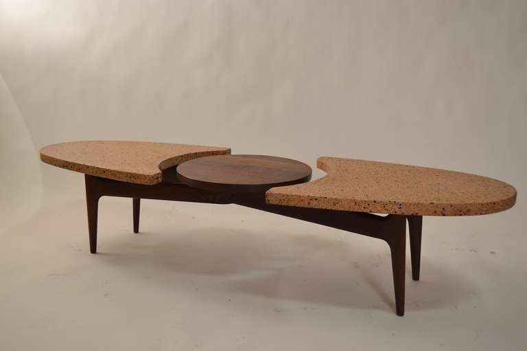 Sculpted walnut  base with terrazzo surfboard form marble top. Unusual and hard to find form. Classic Late fifties, early sixties coffee table.