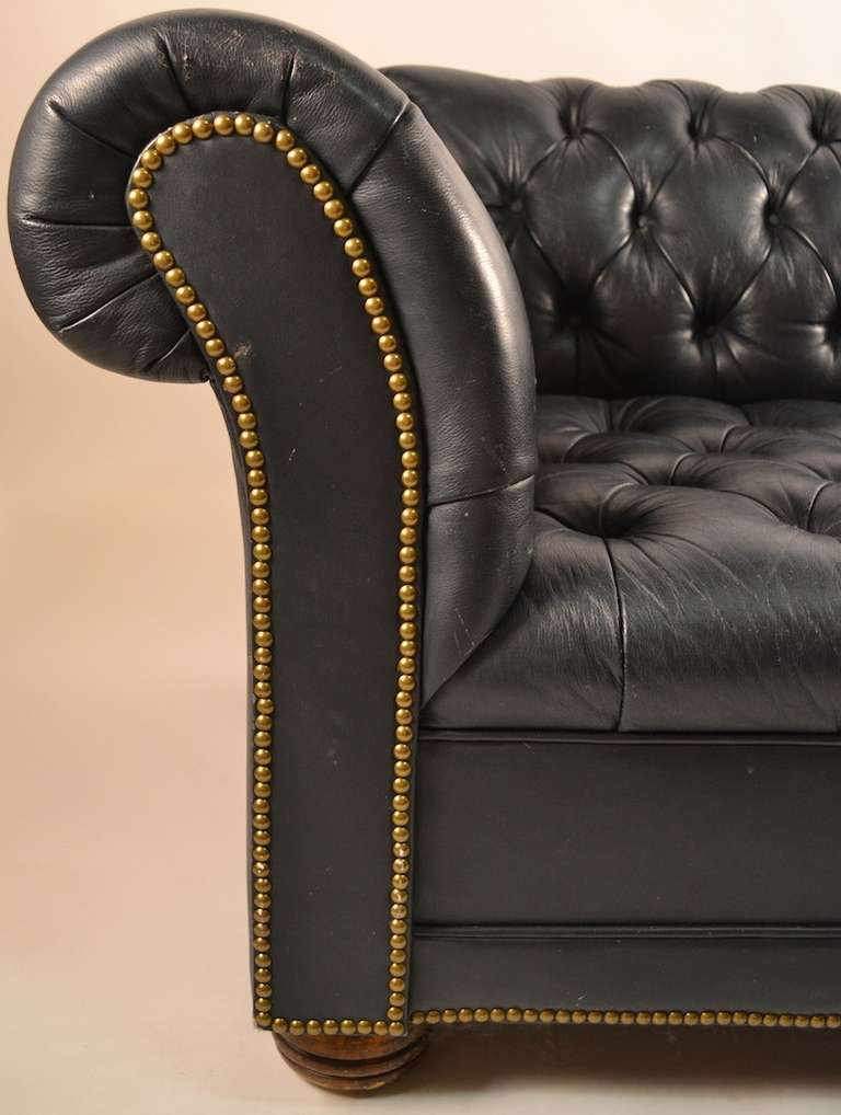 leather couch with brass studs