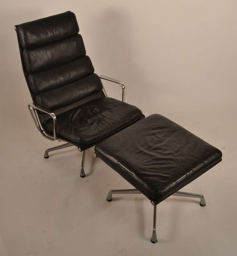 Classic Charles Eames for Herman Miler lounge, with ottoman. Black leather upholstery, aluminum frame, swivel chair and ottoman.