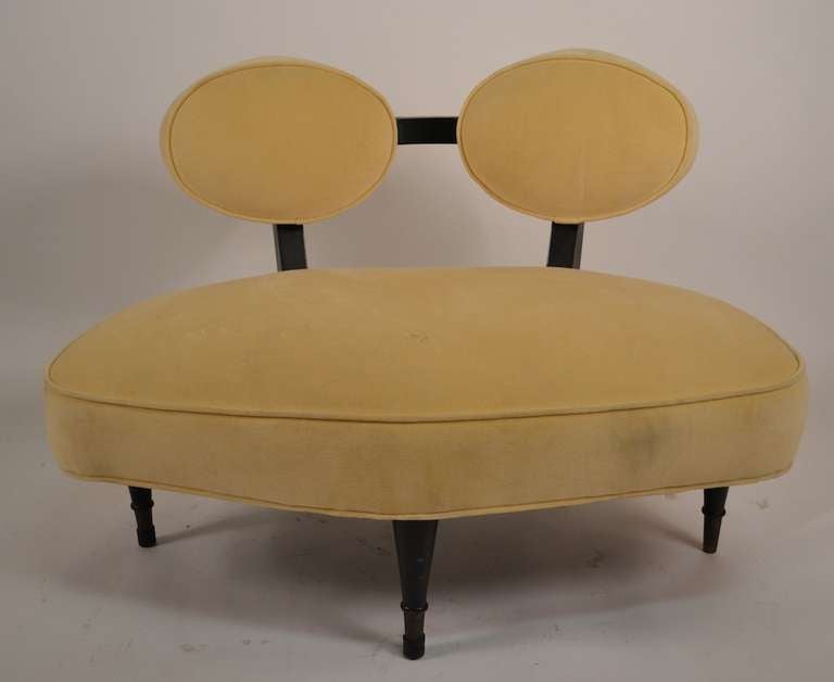 Stylish pair of loveseat, small sofas with diamond shaped back rests. Black painted wood frame, pale yellow upholstery. Wear to upholstery.