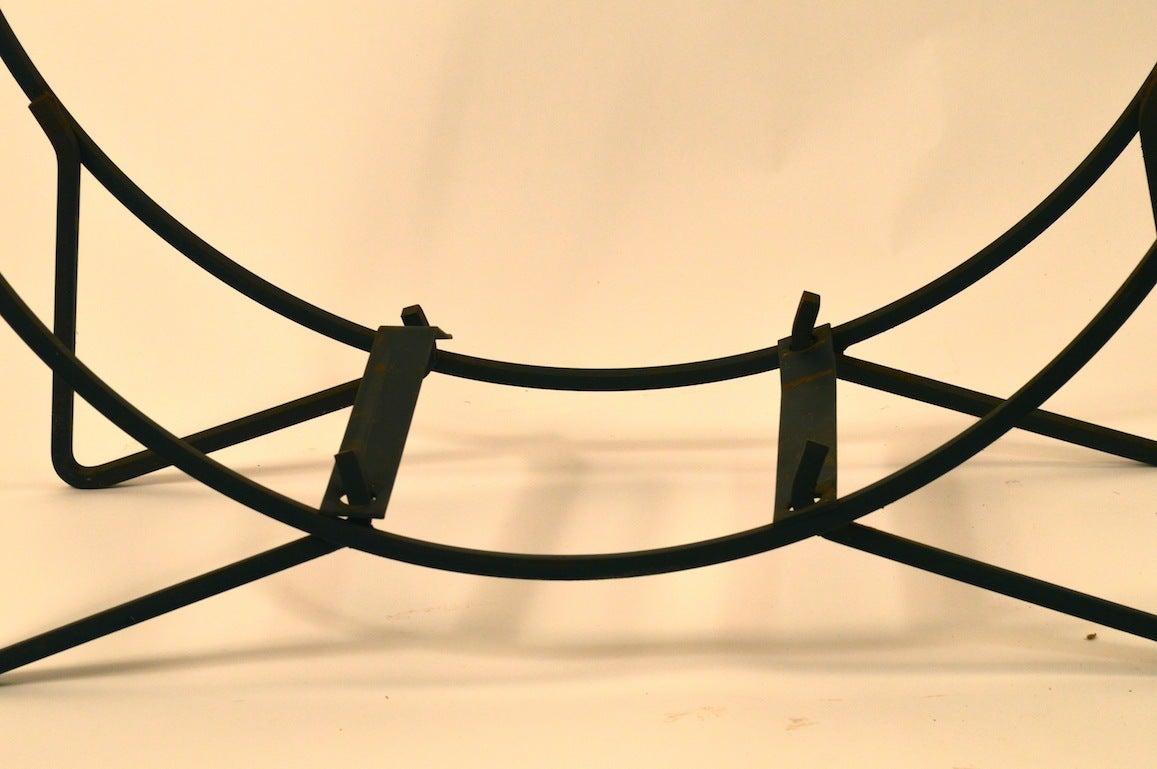 Nice quality hand wrought squared stock circular freestanding log holder. Mid Century Modern period fireplace accessory.