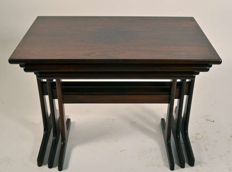 Rosewood Danish Modern nesting table set attributed to Vildbjerg Mobelfabrik design byKai Kristiansen. <br />
These tables are in original as found, untouched condition. As such, there is variations in the color on the top surface, where a lamp, or