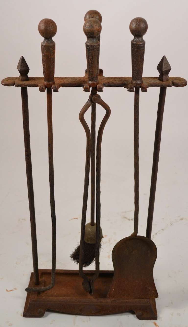 This set includes the brush, tong, shovel, poker, and stand. Hard to find the complete sets intact and original. Some light surface rust on the metal, as shown, this can be left as patina, or removed if you prefer. Marked 