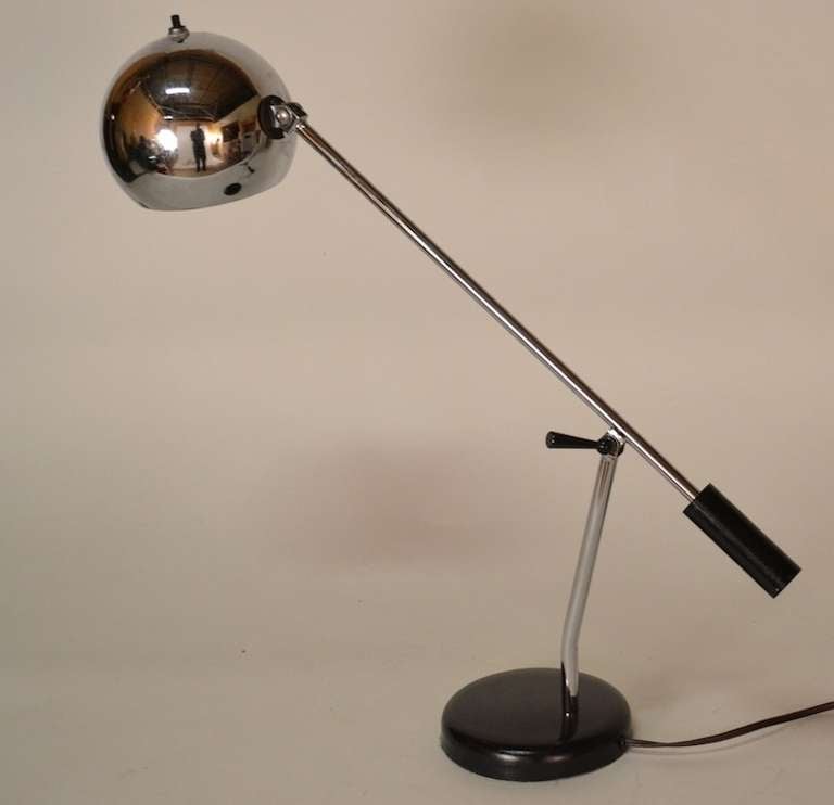 Articulated adjustable arm and ball shade, desk, work, reading lamp. Classic black and chrome motif counter weight lamp of the period.
L of arm ( w/o ball ) 17.5
 Ball shade 5