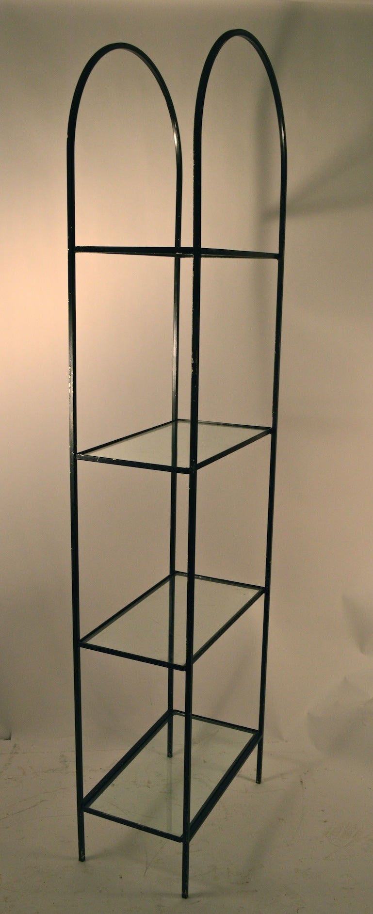 Interesting Mid Century  dome top metal and glass etagere. The black paint finish shows wear and is worn off in spots. We can repaint it black for you, or leave it in as found condition.
