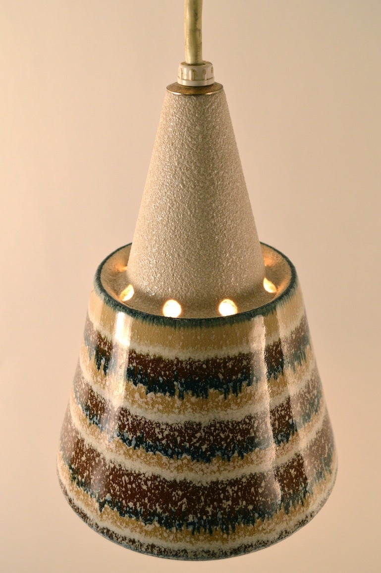Interesting diminutive ceramic pendant fixture, probably California made, in the Danish Modern style.  Textured glaze on top and bottom, high gloss middle section. Total Drop as shown 16