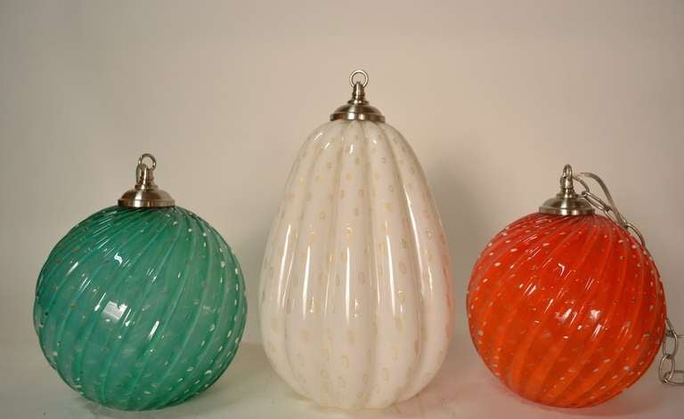 3 Hanging Murano Fixtures, selling indivigually.The Orange one is shown with the chain, all are available with chain, canopies etc.
Dimensions in listing are for the round ones dimensions for oblong one is as follows. 
15.5 - total H x 13